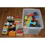 A good assortment of plastic and tinplate battery operated, friction drive and clockwork toys,