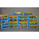 Nineteen boxed Tesco branded diecast truck models, some by Corgi, including curtainside lorry,