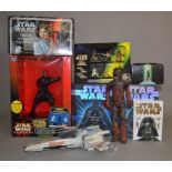 A mixed lot of Star Wars items: two A Pop-up Guide to the Galaxy books;