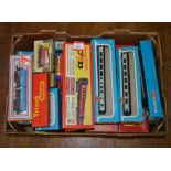 OO gauge. A good quantity of rolling stock and accessories by Lima, Triang, Wrenn and others.