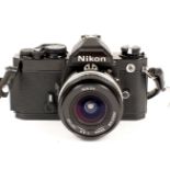 Black Nikon FM with 20mm Nikkor Lens.
