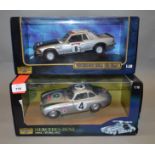 Two boxed Ricko Mercedes Benz diecast model cars in 1:18 scale,