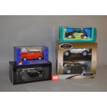 Five diecast models, mainly 1:18 scale, including two ERTL Grandes Marques (Range Rover Sport,
