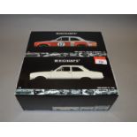 Two boxed Minichamps Ford Escort I TC diecast model cars in 1:18 scale,