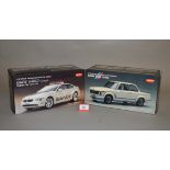 Two Kyosho 1:18 scale diecast model cars: BMW 2002 Turbo; BMW 645Ci Moto GP Safety Car.