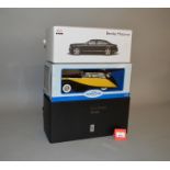 Three 1:18 scale diecast model cars, including Rastar Bentley,