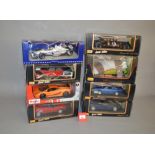 Eight 1:18 scale diecast model cars, mostly Maisto but one Minichamps, including McLaren F1,