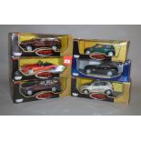 Six Motor Max 1:18 scale diecast model cars, including BMW and Chrysler. E in G boxes.