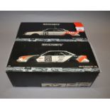 Two boxed Minichamps Audi V8 Quatro diecast model cars in 1:18 scale, DTM 1990 and 1992.