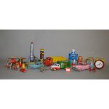 A Good selection of Tin-Plate and battery operated toys, including a Louis Marx Tipper Truck.