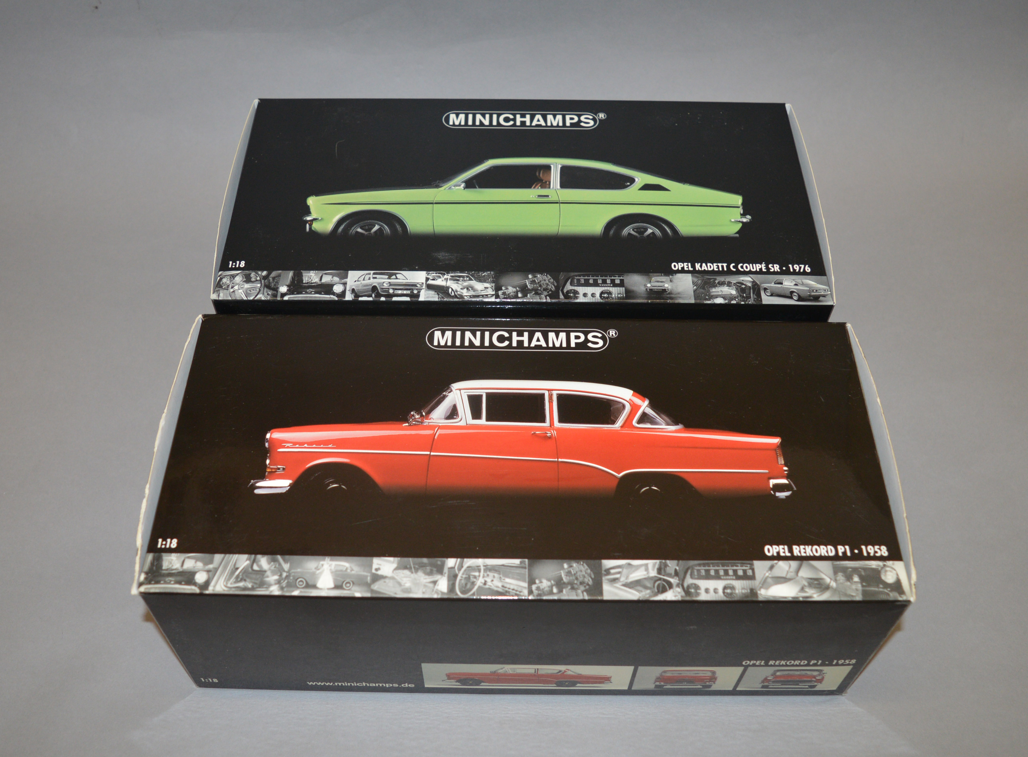 Two boxed Minichamps diecast model cars in 1:18 scale,
