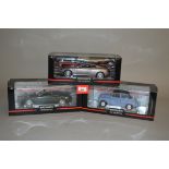 Three Minichamps 1:18 scale diecast model cars: Morris Minor Cabriolet; Aston Martin DB9 2004;