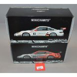 Two boxed Porsche 911 GT3 RSR diecast model cars in 1:18 scale,