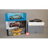 Four 1:18 scale diecast model cars including a Chrono Lotus Elise 1997; WhiteBox Aston Martin.