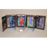 Four NECA Reel Toys action figures in book style boxes: Predator; A Nightmare on Elm Street;