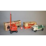 Two Triang toys: Jones KL 44 Crane; Milk Lorry, with roof sign and one milk bottle.