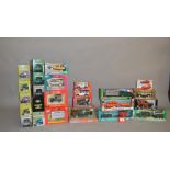 A good quantity of boxed diecast models by Bburago, Britains and others,