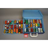 A blue plastic Matchbox Collectors Case with white plastic handle and metal latch,