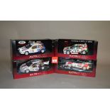 Four AutoArt Racing Division 1:18 scale diecast models, two Ford Focus and two Toyota Corolla.