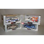Four UT Models 1:18 scale diecast model cars: Porsche 993 Coupe; Porsche 911 GT Le Mans 1996;