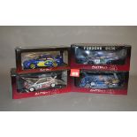 Four AutoArt Racing Division 1:18 scale diecast model cars: Mercedes-Benz CLK GTR; Porsche 917K;