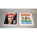 Two vintage Lyons Maid metal ice cream signs, one promoting the Lyons Maid brand,