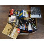 A large mixed lot of books, games and other items, including James Bond books, robots,