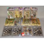 12 x Kiss action figures by McFarlane and Figures Toy Co. All carded, F-VG.