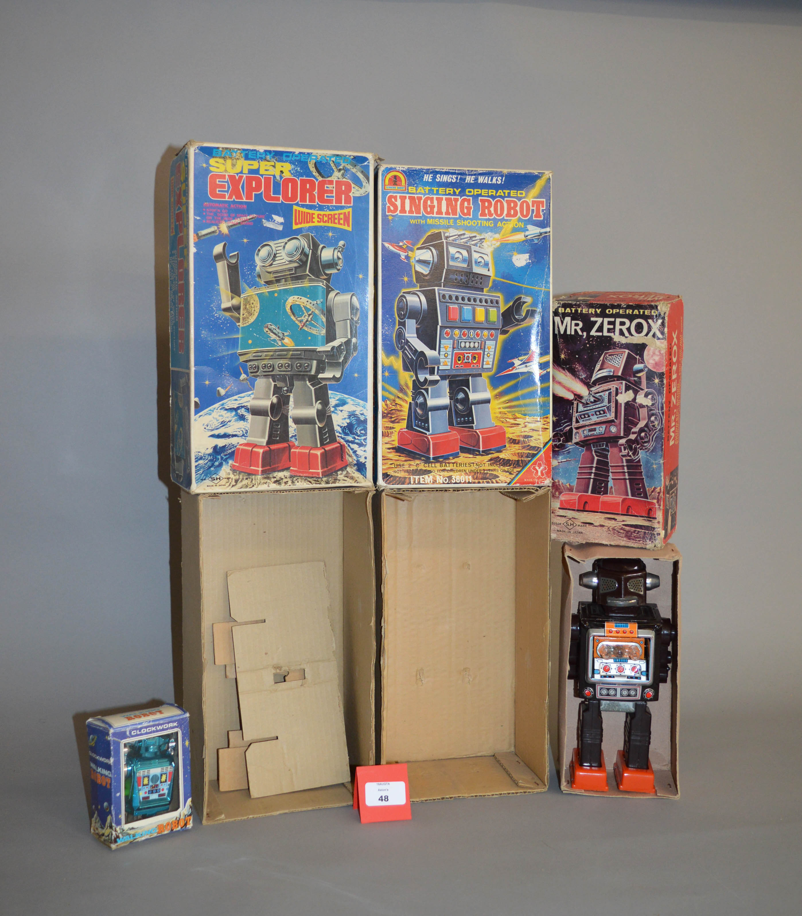 Two robot toys, and two empty boxes: Horikawa (Japan) Mr Zerox, brown tinplate and plastic robot,