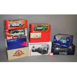 Nine assorted boxed diecast models in 1:18 and 1:24 scale, including examples by Maisto, Bburago,