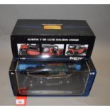 Two boxed Ricko diecast model cars in 1:18 scale,