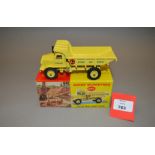A boxed Dinky Supertoys 965 Euclid Rear Dump Truck in yellow with yellow hubs and windows.