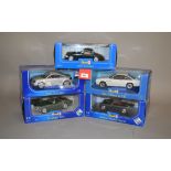 Five Revell 1:18 scale diecast model cars: Triumph TR4; Audi TT Coupe; Austin-Healey Sprite;