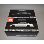 Two boxed Minichamps BMW M3 GTR 'Street' diecast model cars in 1:18 scale, 1987 and 2001 variants.
