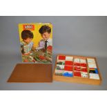 A good quantity of Lego pieces housed in a wooden box, approximately 40 x 48 x 7cm,
