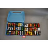 A blue plastic Matchbox Collectors Case with yellow plastic handle,