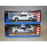 Two boxed Ricko diecast model cars in 1:18 scale, Ford RS200 (1986) and a Ford RS200 (Rally),