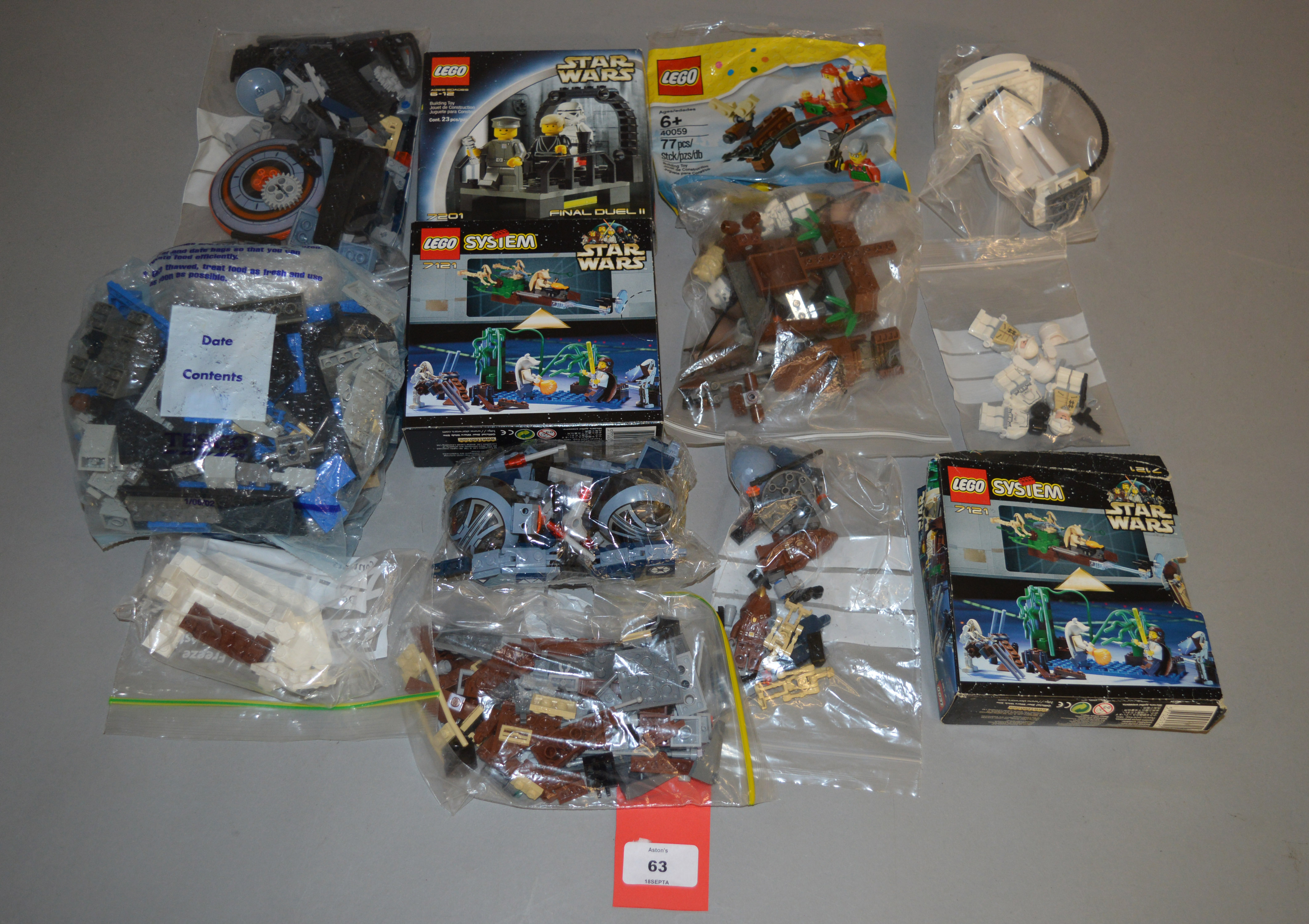 A small quantity of assorted Lego pieces, some with boxes and instructions,