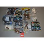 A small quantity of assorted Lego pieces, some with boxes and instructions,