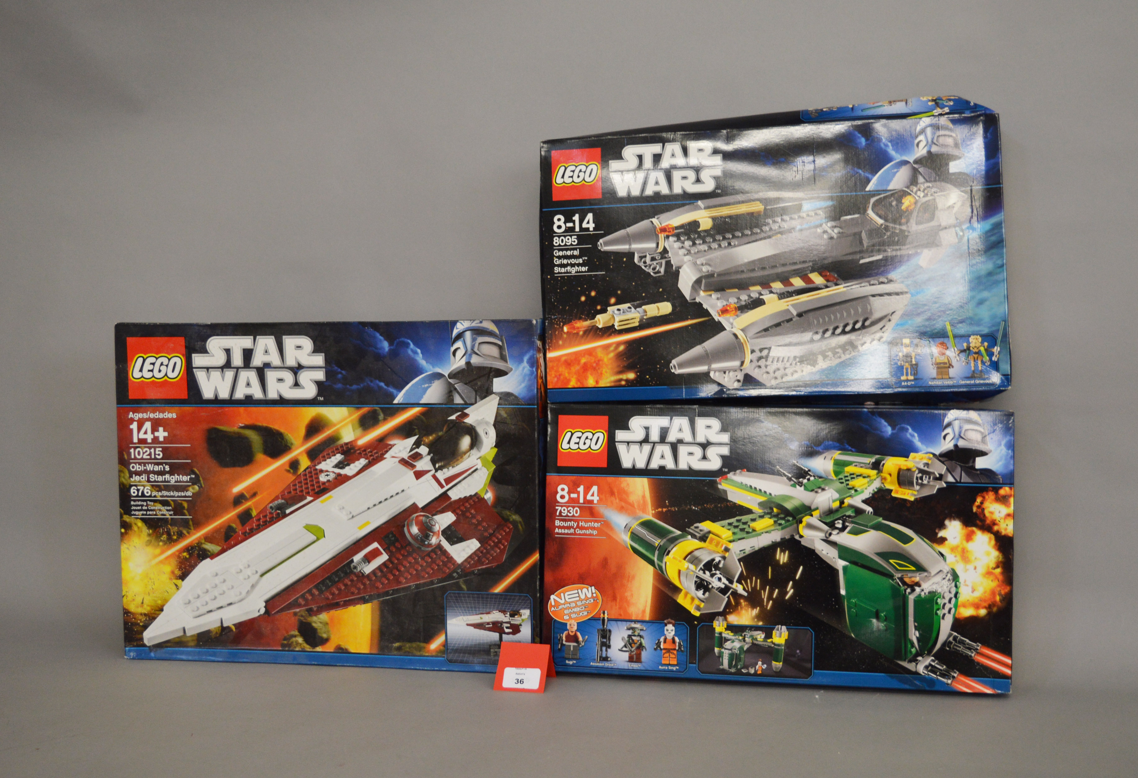 Three Lego Star Wars sets: 10215 Obi-Wan's Jedi Starfighter; 7930 Bounty Hunter Assault Gunship;