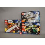 Three Lego Star Wars sets: 10215 Obi-Wan's Jedi Starfighter; 7930 Bounty Hunter Assault Gunship;