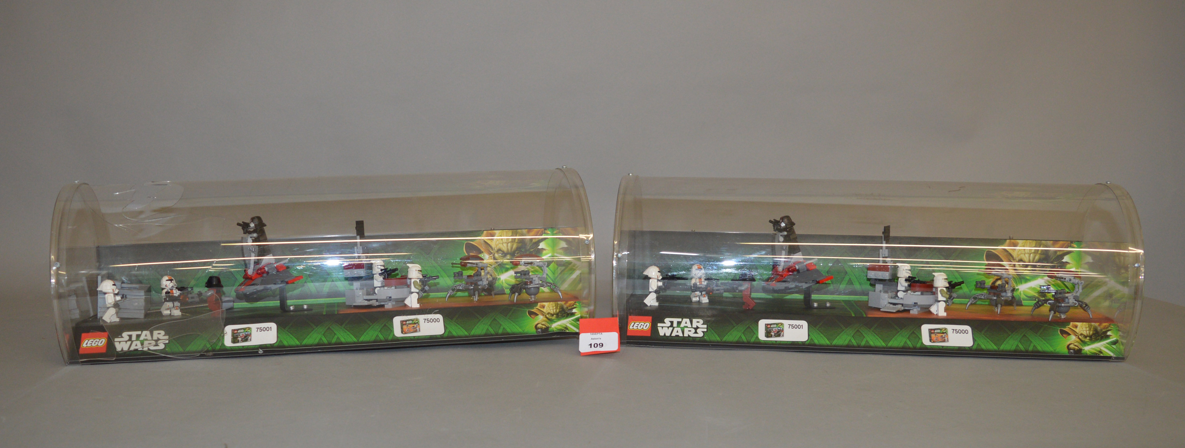 Two Lego Star Wars clear plastic retail display cases, approximately 50cm wide,