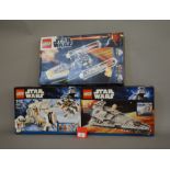 Three Lego Star Wars sets: 9495 Gold Leader's Y-wing Starfighter; 8089 Hoth Wampa Cave;