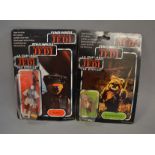 Two Palitoy Star Wars 3 3/4" action figures sealed on tri-logo 70 back cards: Princess Leia in