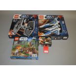 Four Lego Star Wars sets: 9492 TIE Fighter; 9525 Pre Vizsla's Mandalorian Fighter; 7956 Ewok Attack;