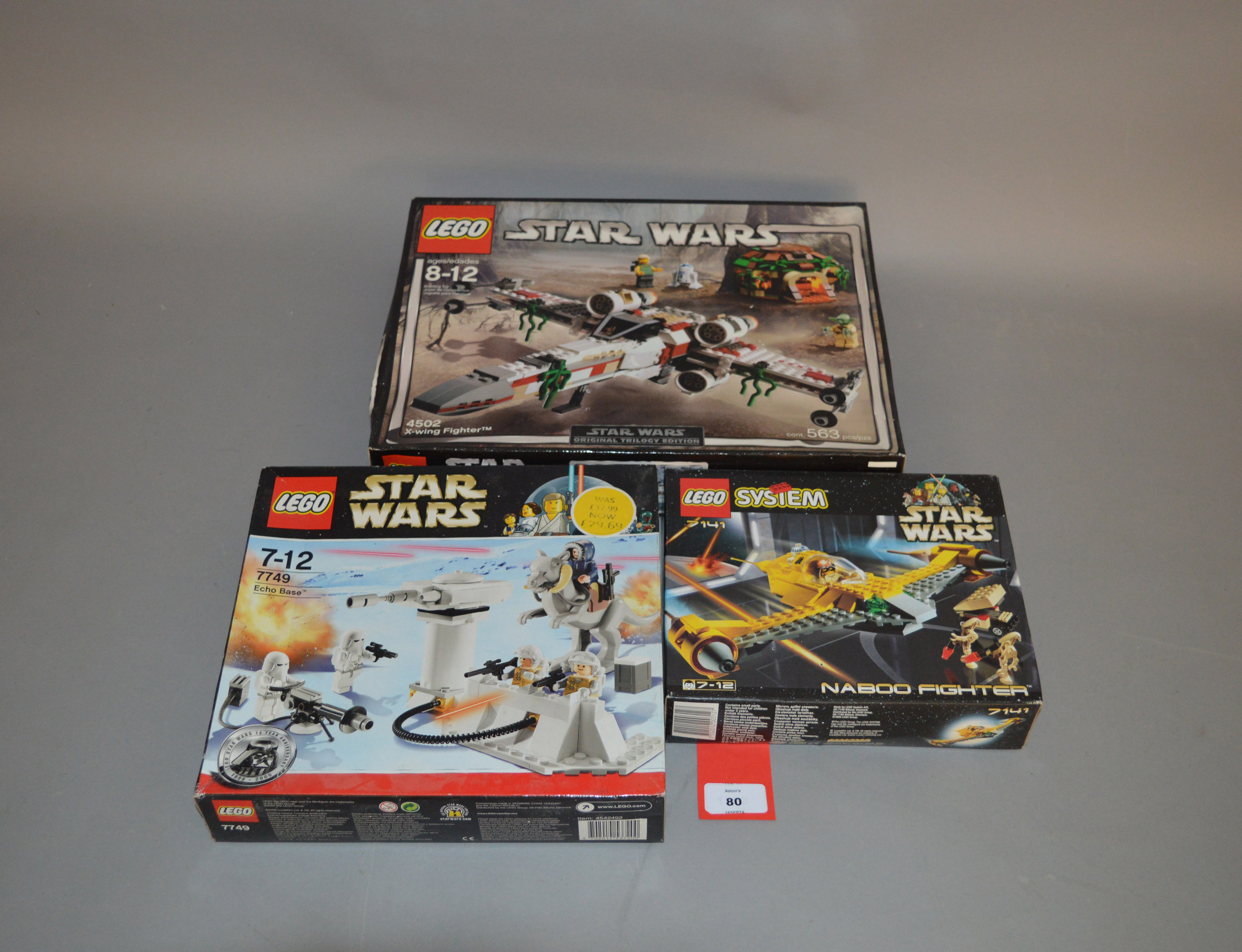 Three Lego Star Wars sets: 4502 X-wing Fighter; 7749 Echo Base; 7141 Naboo Fighter. All sealed.