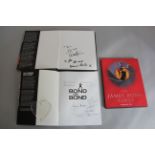 Bond on Bond book signed by the author Roger Moore on title page with six other autographs