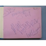 Autograph book containing the signatures of Marc Bolan and T Rex including Mickey Finn, Bill Legend,