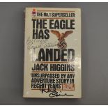 Michael Caine and Donald Sutherland signed "The Eagle has Landed" paperback book by Jack Higgins.