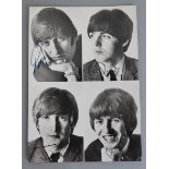 The Beatles signed photo by all four band members George Harrison and Ringo Starr have signed in